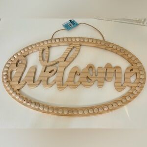 Unfinished beaded oval “Welcome” sign